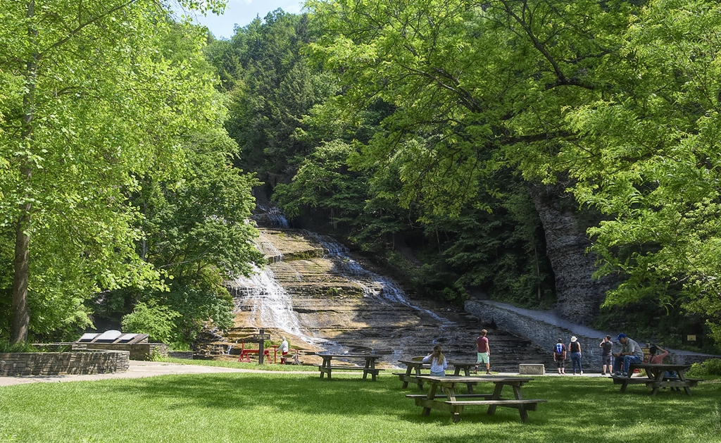 Beautiful view of Buttermilk Falls State Park / Flickr/ Jo Zimny
Link: https://www.flickr.com/photos/joeyz51/41937374804/in/photolist-26TS1sh-9vgMb5-27UYAHd-2nyKCeG-24oBLee-2nyKAy2-78Zydr-78Zr8x-233hJoW-sBjk1V-794mNd-78ZBmn-78ZtCt-78ZpVc-2nyN425-25ewLh3-94KdN9-78ZAKD-794nXE-794q73-78Zqp4-794eWy-794kp3-78Zo7K-794vFQ-794gkA-794xh5-78Zpfa-26BGFHP-794dQd-ikPKtc-ty9Qt4-pfTNZi-JdsV5M-237qB95-78ZFsP-2nyMVKg-txRok3-78ZseK-78Ziyx-2hFbNDZ-6Ej7r1-8Mq5WQ-ffJBhW-2hT6cws-oRRrbB-29M5ZDx-2nyKwtr-21Mquvv-794jfm