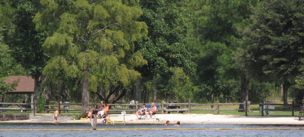 People enjoying at Jones Lake State Park Beach / Flickr / Gerry Dincher
Link: https://www.flickr.com/photos/gerrydincher/9595563146/in/photolist-fBVLBU-6tSBFj-2kaCdPg-2j4gyDU-2r9X4X-TmqnLs-2e6MgTk-7ZvUN4-y9JtK-2mPYpDT-x3BoVR-2iw6Ywp-7MXHYK-fnJp1E-241L7ew-x6Bt1a-7MXJhV-7MXHsn-Tmqnrj-6LfanP-5SmDyX-NfPUGh-4Y6Wia-2kK6jcE-2kK6jbs-xbYtdA-2kK28oQ-2kK2yGf-2kK2yFt-2kK1UiG-2kK6ioz-2kK6foB-2kK2vut-2gW8DfM-H18NqT-wNSwy9-x76cSe-2kAfmpc-7MXJpc-6LfaCT-2kzDqgo-w9UtuF-2kzE6B3-x631yf-7N2HMw-2kK6vCp-4YbbEN-w9sJvq-2kK6afw-wP2cTd