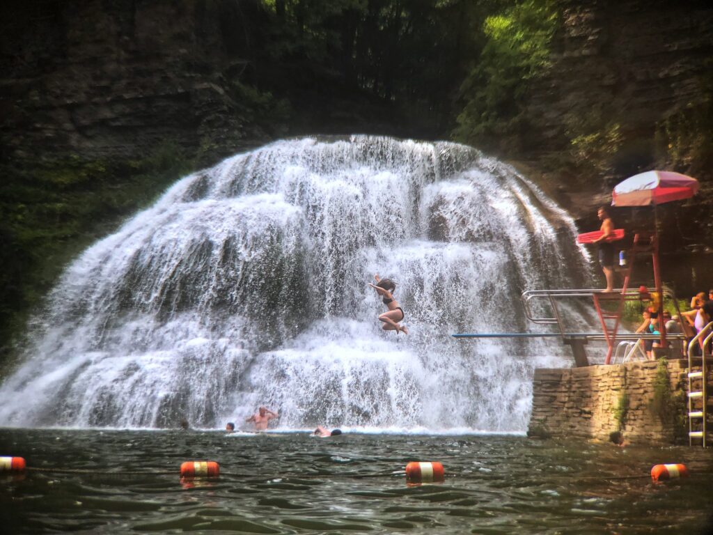 People swimming at Robert H. Treman State Park / Flickr / Shelby L. Bell
Link: https://www.flickr.com/photos/vwcampin/43295271684/in/photolist-LtodM7-LiqCpZ-28XRzTs-Lwz4TZ-2nUsq7T-2nUv2ys-MVRpnd-LnuTeF-2dRYqoN-KBeqbD-Lnrk7W-KBbJFF-2dQtpCp-LjWUTj-2dBtJja-2nUv4gA-RsXWsg-PzGMm2-241e8U4-Lcsagq-2nUv2X8-2nUtMLq-Lv97wb-KBh19K-2nUuD4V-Lv3wyw-2m8wEDC-2nUpHr4-2nUtMut-2nUpJqD-Kxr1LJ-2nUv24K-KG4iiF-2m8L7Kv-Ly5QRa-2m8L7Gp-2nUpHzF-2m8PTzx-2nUv2up-2m8M4iL-2m8Gmgx-2m8M4Pq-2nUpHCG-2m8PRRN-2m8GkLQ-2m8GmmN-2m8Lbkb