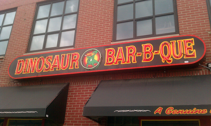 Signage Outside the Restaurant of Dinosaur Bar-B-Que / Flickr / Jeff Sents
Link: https://flickr.com/photos/jeffsents/5673738796